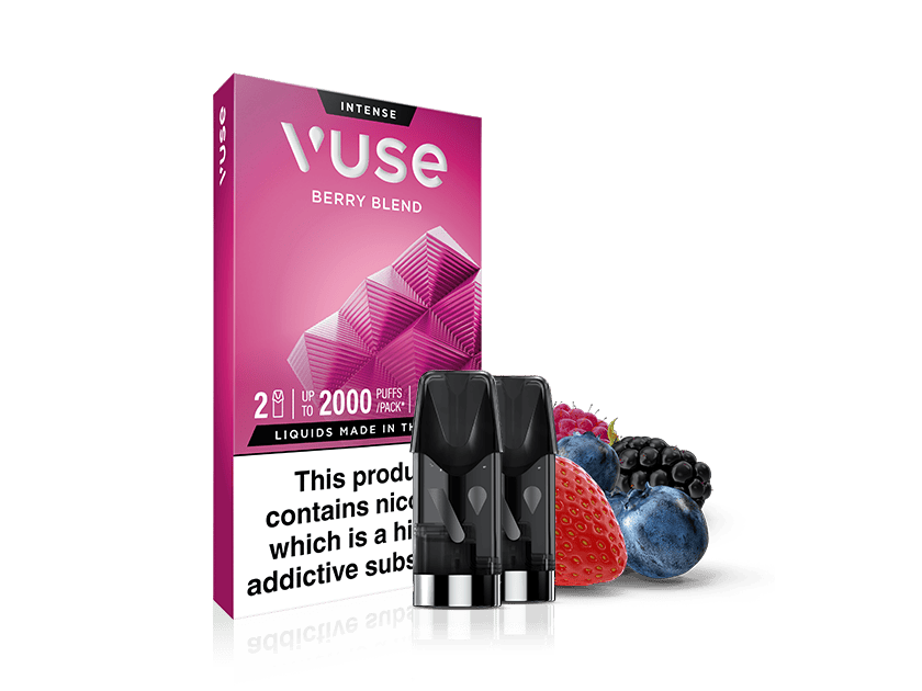 A Vuse Berry Blend vape pod pack with two vape pods in front, alongside fresh berries including a strawberry, blackberry, and blueberry, on a white background.