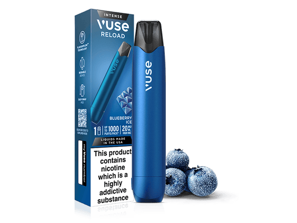 A Blueberry Ice Vuse Reload Pen stands next to its matching box, with three frosted blueberries nearby. The packaging warns: This product contains nicotine which is a highly addictive substance.