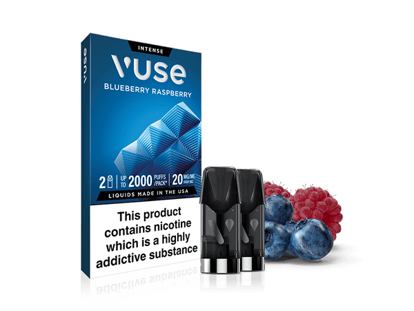 A box of Blueberry Raspberry Vuse Extra Intense Flavour Pods stands upright beside two Vuse PRO compatible pods, with fresh blueberries and raspberries. The packaging states: “This product contains nicotine which is a highly addictive substance.”.