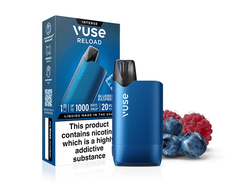A blue Vuse Reload vape device stands next to its packaging, labeled Blueberry Raspberry. Fresh blueberries and raspberries are placed in front. The box displays a nicotine warning in bold black text.