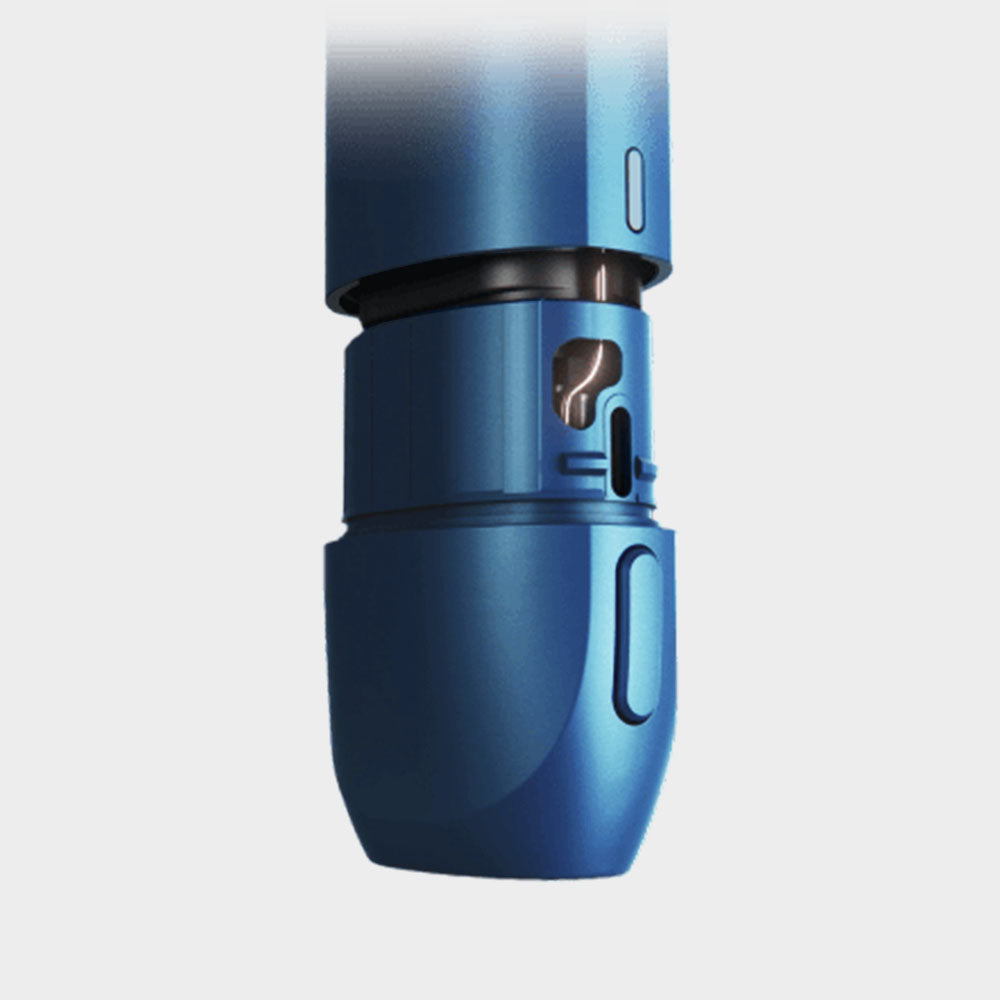 Close-up of a blue cylindrical device with a rotating dial featuring white markings and a cut-out window, possibly part of a medical injector pen or a similar precision instrument.