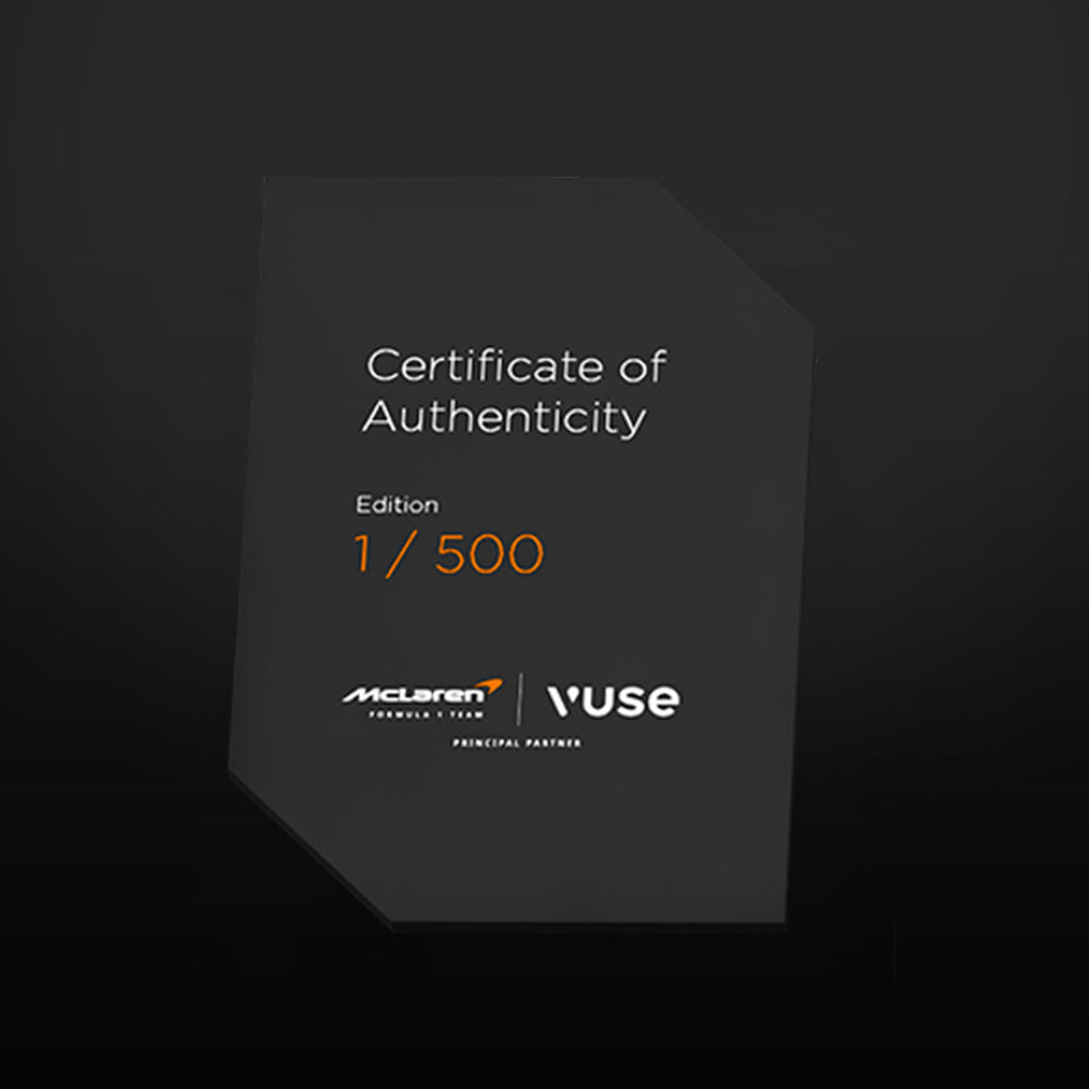 A black, angular Certificate of Authenticity card displaying “Edition 1/500,” with McLaren and Vuse logos at the bottom, on a dark background.