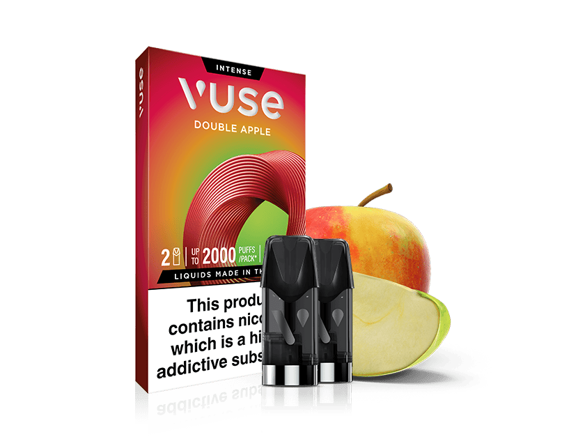 A Vuse Double Apple vape pod pack with three pods is shown in front of a whole and a sliced apple. The packaging is red and yellow with text highlighting the flavor and nicotine warning.