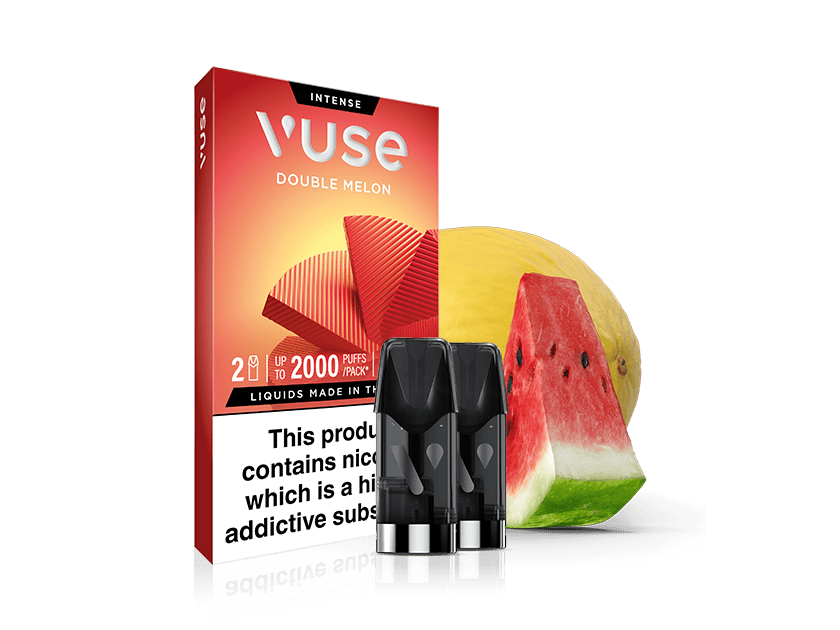 A Vuse Double Melon vape pod pack is shown with three vape pods in front, alongside slices of watermelon and a yellow melon, on a white background. The box includes a nicotine warning label.