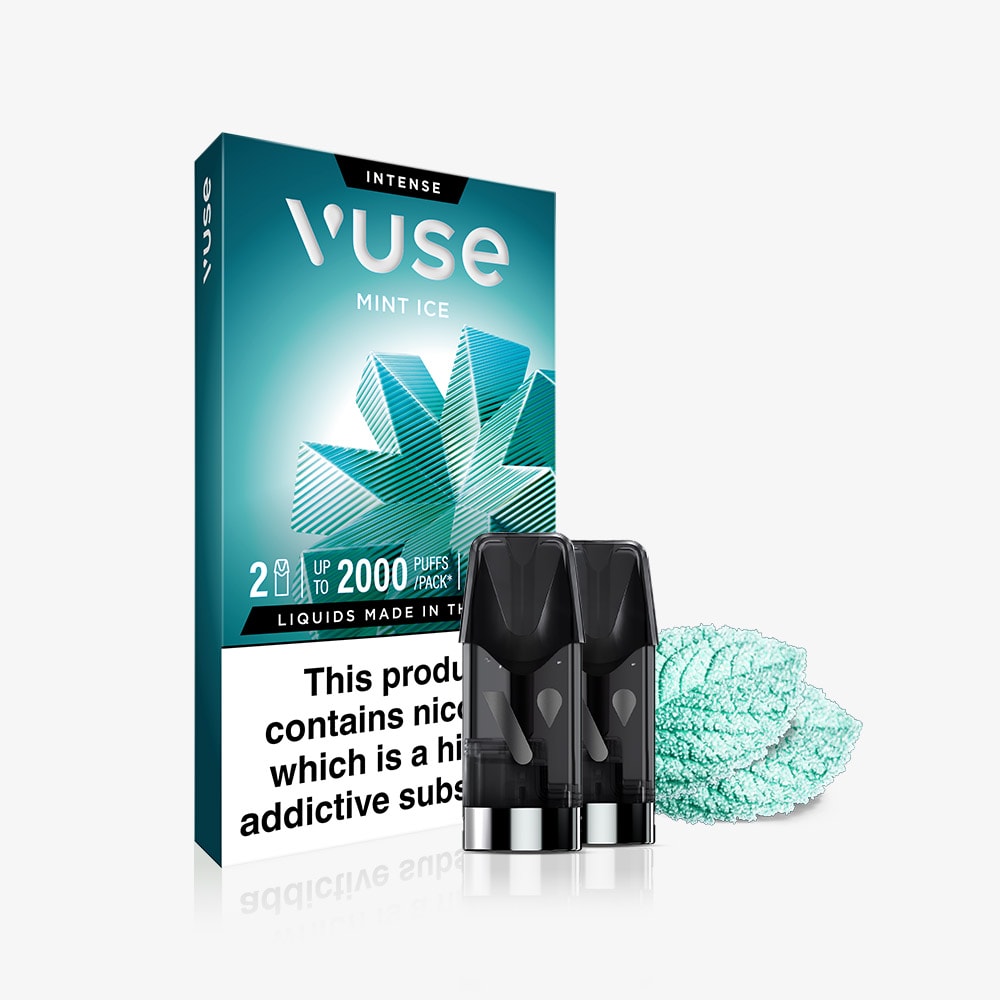A pack of Mint Ice Vuse Extra Intense Flavour Pods by Vuse, containing two PRO compatible pods, sits in front with mint leaf graphics on the packaging and mint leaves nearby. The box features a health warning label at the bottom.