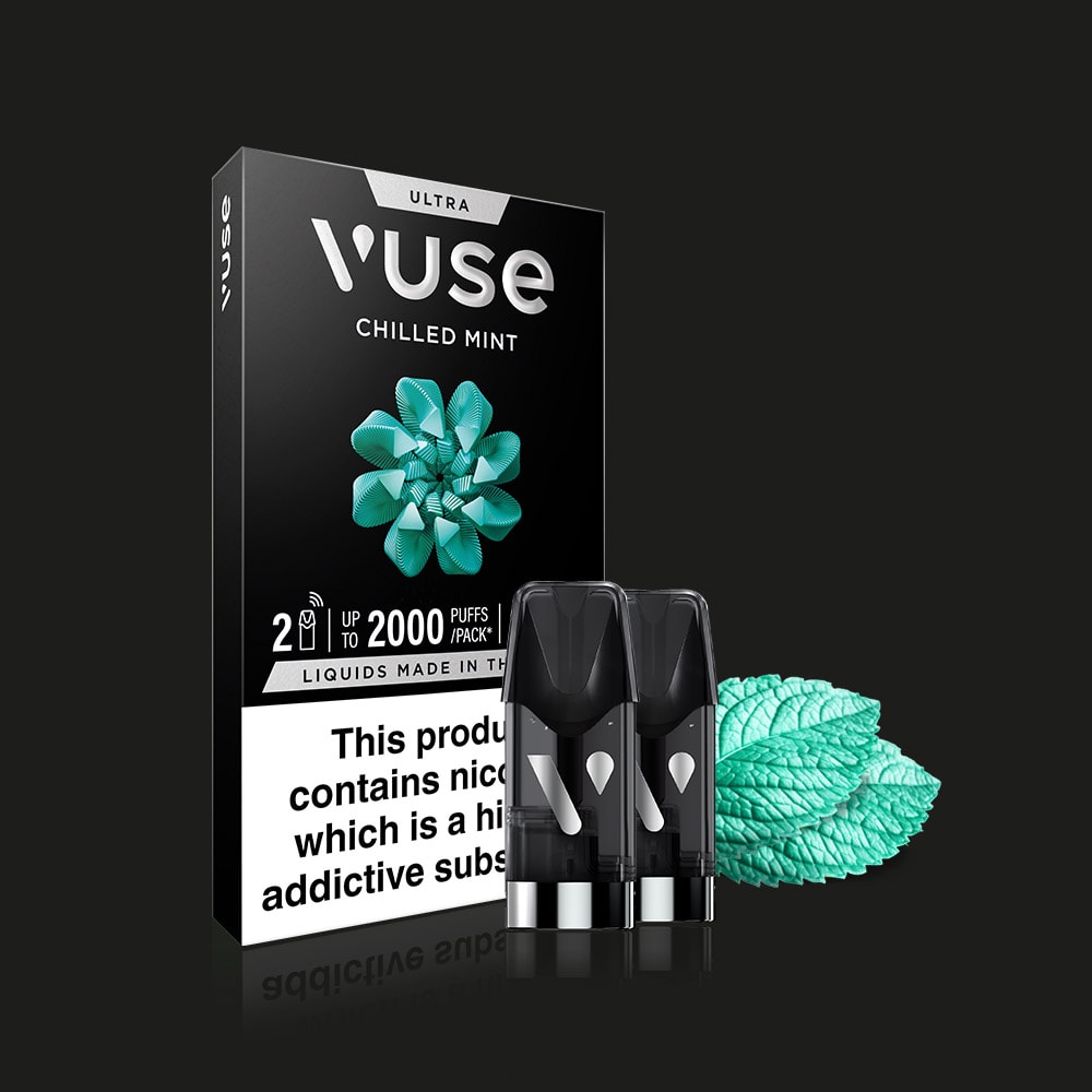 A Vuse Chilled Mint Ultra Smart Pod box in black with a mint graphic, two Vuse Smart Pods in front, and fresh mint leaves on the side. The packaging highlights smooth mint flavour and warns of nicotine’s addictive properties.