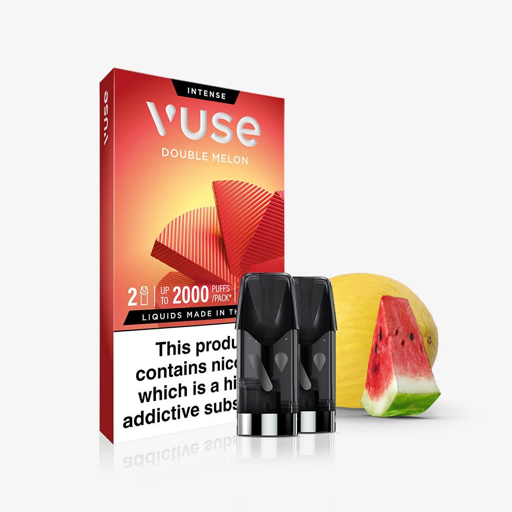 A pack of Vuse Double Melon Extra Intense Flavour Pods with two pre-filled pods sits in front of a melon and watermelon slice, next to a partially visible nicotine warning label. Enjoy smooth nic salts from Vuse’s Double Melon flavour.