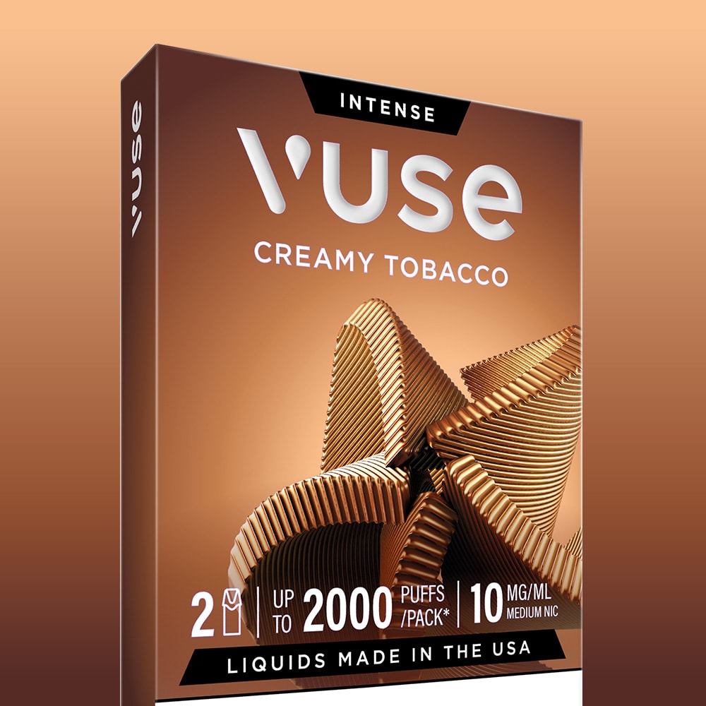 A box of Creamy Tobacco Vuse Extra Intense Flavour Pods with curved brown designs. Each pack offers 2000 puffs, 10 mg/mL nicotine, and Vuse PRO compatible e-liquids made in the USA, displayed on a brown gradient background.