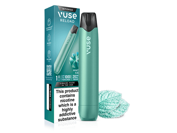 A Vuse Mint Ice Aqua Vuse Reload Pen stands beside its box, showing product info and a nicotine warning. In front are two mint leaves and the reusable device with its Mint Ice prefilled pod.