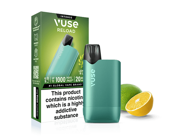 A Vuse Lemon & Lime Vuse Reload reusable vape device stands by its box, featuring flavor icons, health warnings, and prefilled pod details. A whole lime and a halved lemon are placed nearby against a white background.