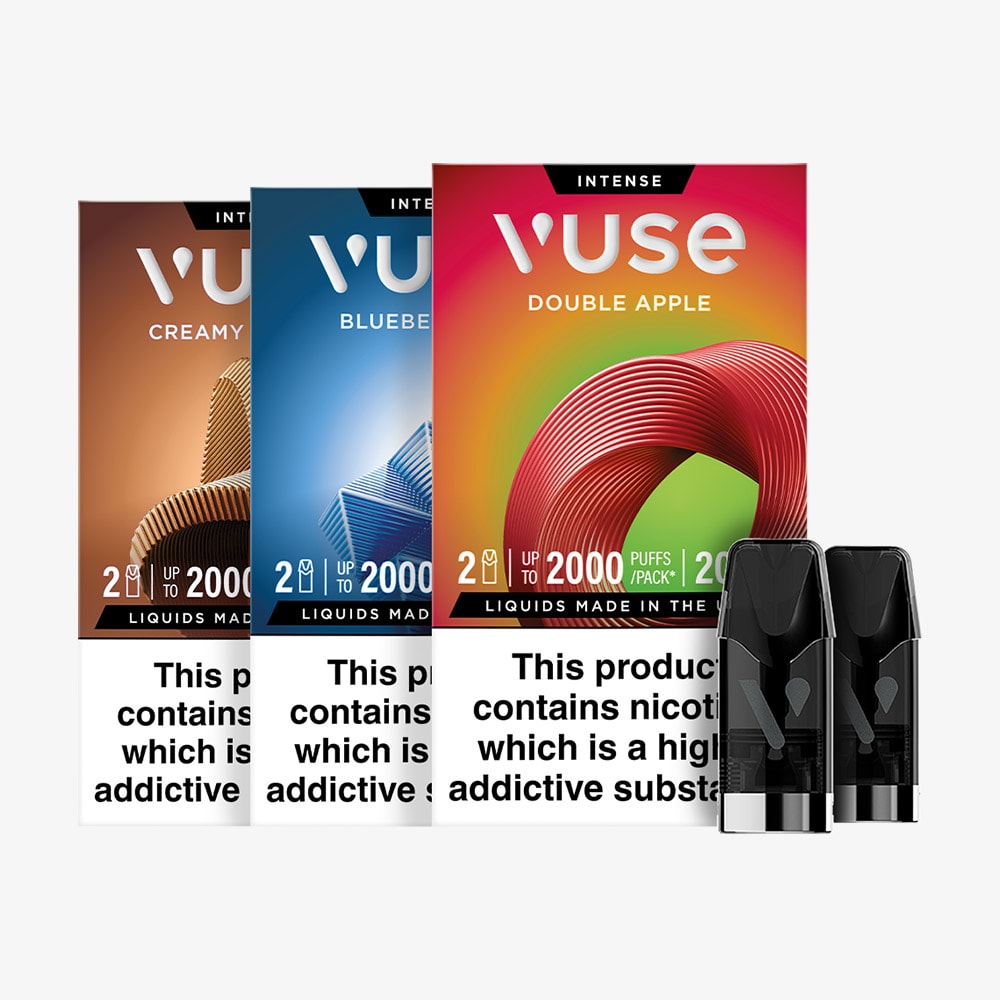 Three boxes of Vuse vape pods in Creamy Tobacco, Blueberry Ice, and Double Apple flavors, with two vape pods in front. Each box displays a nicotine addiction warning at the bottom.