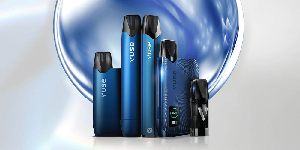 A group of five sleek, blue Vuse vape devices and pods are displayed upright against a shiny, abstract blue and white background. The devices vary in size and design, with the Vuse logo visible on each.